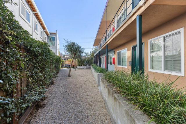 a front view of a house with large windows