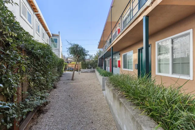 a front view of a house with large windows