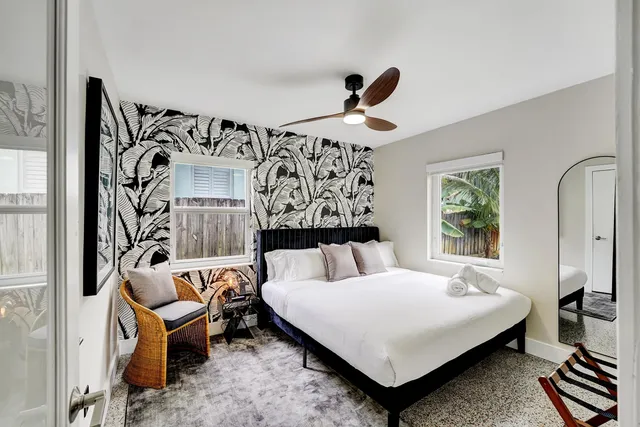 a bedroom with a bed and window