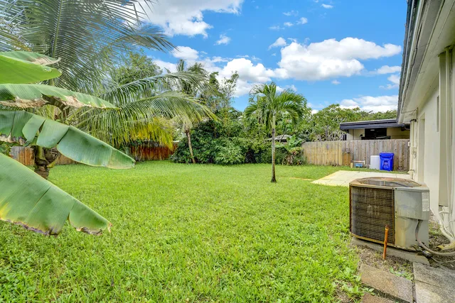 a backyard of a house with lots of green space