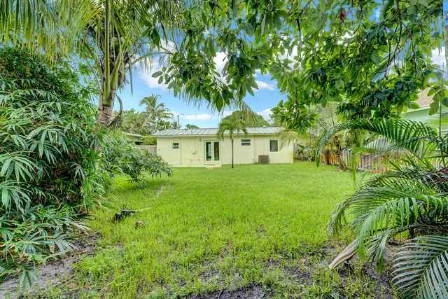 a view of a garden with a building