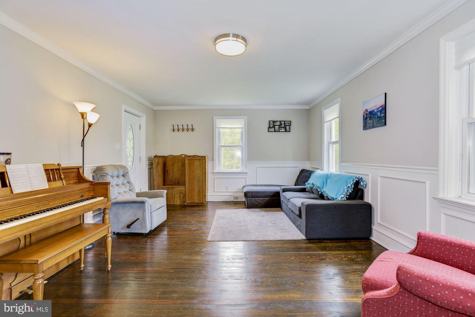Living room with Crown Molding and Wainscott Trim