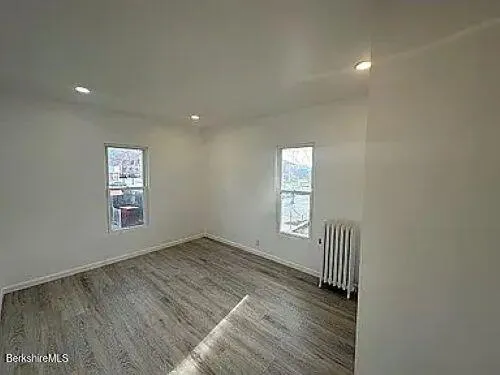 an empty room with windows
