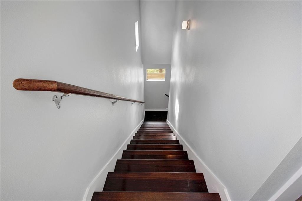 1608 Miriam Avenue, Unit B Austin, TX 78702 - Photo 5 of 10 Stairs featuring baseboards