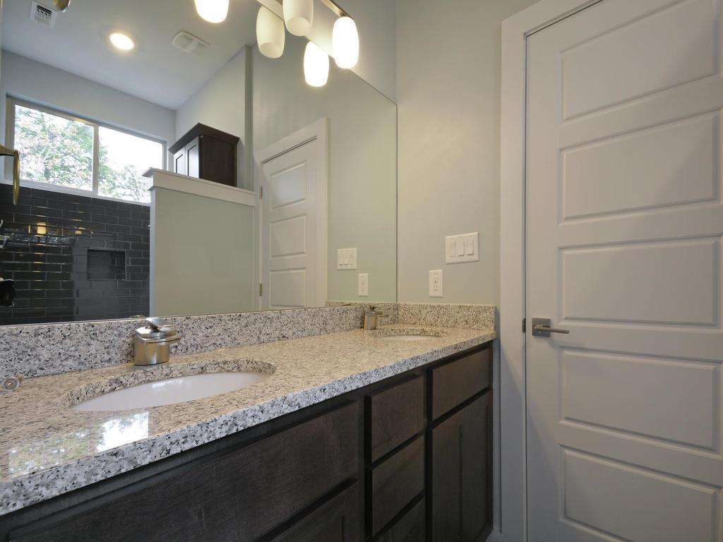 1608 Miriam Avenue, Unit B Austin, TX 78702 - Photo 8 of 10 Full bathroom featuring double vanity