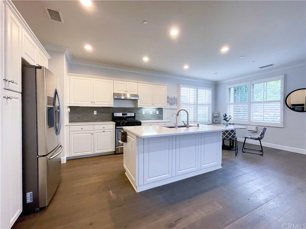 35 Courant Irvine, CA 92618 - Photo 11 of 21 a large kitchen with stainless steel appliances lots of counter top space