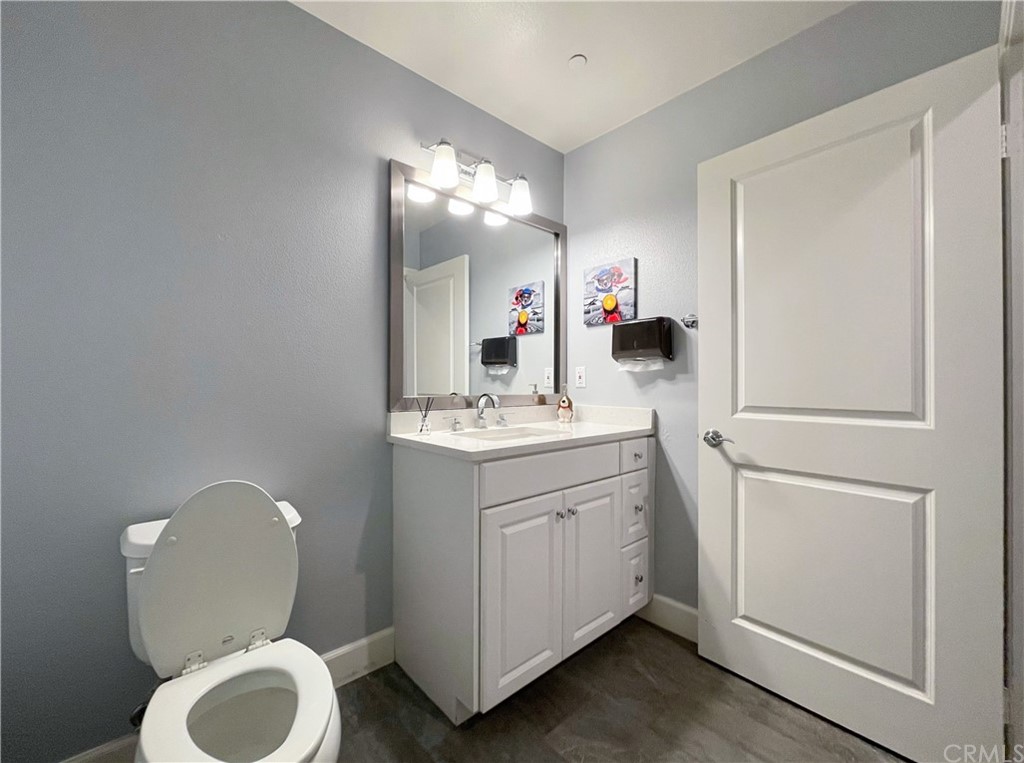 35 Courant Irvine, CA 92618 - Photo 13 of 21 a bathroom with a toilet sink and mirror