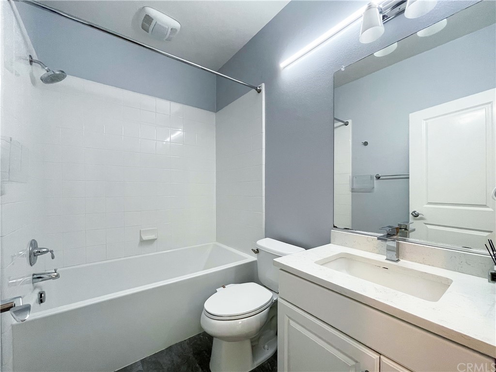 35 Courant Irvine, CA 92618 - Photo 16 of 21 a bathroom with a sink toilet vanity and shower