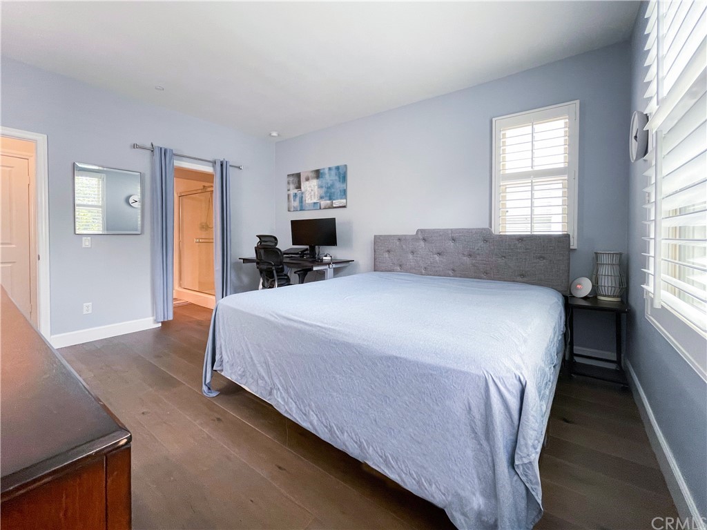 35 Courant Irvine, CA 92618 - Photo 18 of 21 a bedroom with a bed and wooden floor