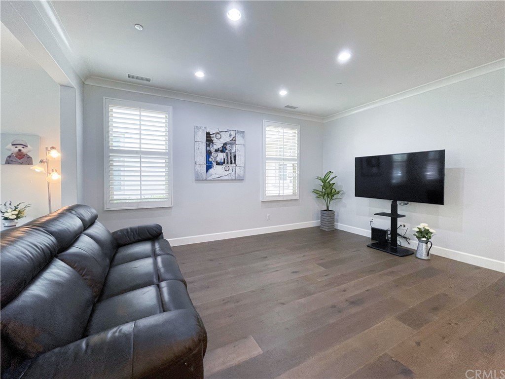 35 Courant Irvine, CA 92618 - Photo 4 of 21 a living room with furniture and a flat screen tv