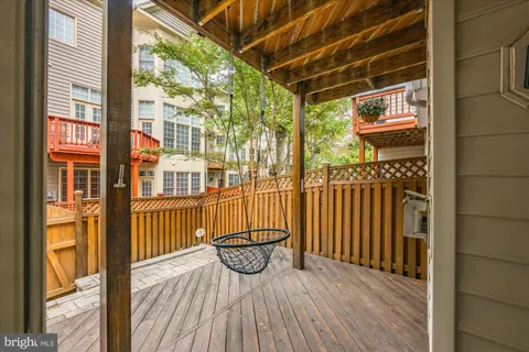 a view of a balcony with wooden floor