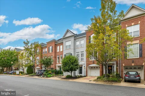 a city street lined with buildings and trees