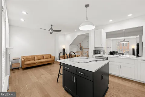 a kitchen with a stove a sink and a refrigerator