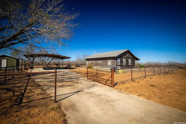 a view of a yard and front view of a house