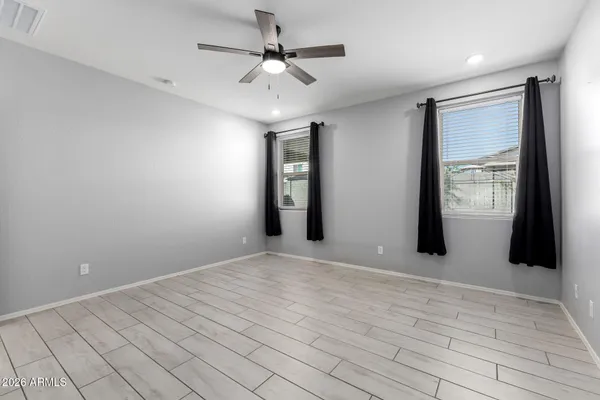 a view of an empty room with a window