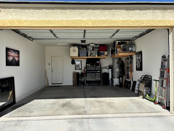 a front view of a house with a garden and yard