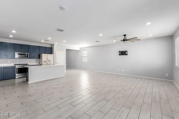 a view of kitchen electric appliances and cabinets