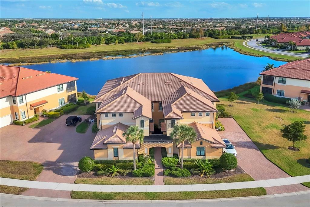 an aerial view of a house with a lake view