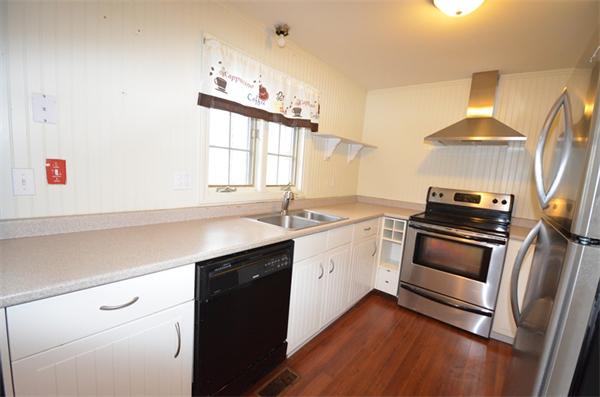 a kitchen with a sink and a stove