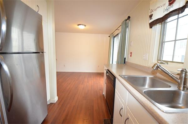 12 Perley Road, Unit 23D Derry, NH 03038 - Photo 3 of 20 a view of a kitchen from a kitchen