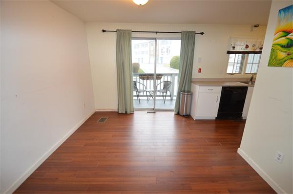 12 Perley Road, Unit 23D Derry, NH 03038 - Photo 4 of 20 wooden floor in an empty room with a window