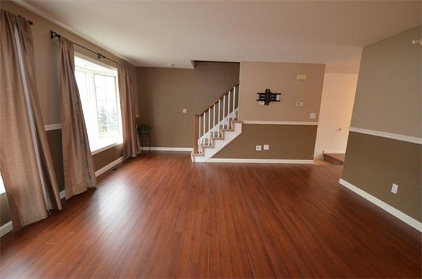 12 Perley Road, Unit 23D Derry, NH 03038 - Photo 5 of 20 wooden floor in an empty room with a window