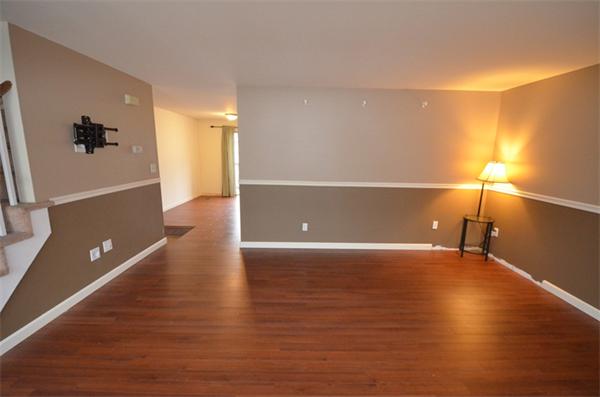 12 Perley Road, Unit 23D Derry, NH 03038 - Photo 8 of 20 a view of a livingroom with an empty space and a window