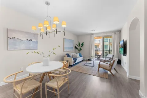 a living room with furniture and wooden floor