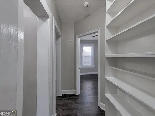 a view of an empty walk in closet