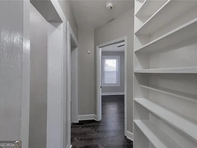 a view of an empty walk in closet