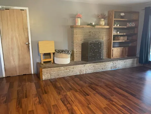 a view of kitchen and dining room with wooden floor