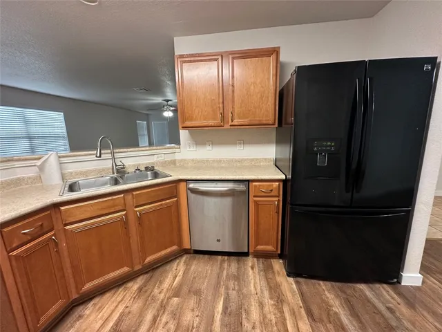 a view of kitchen with microwave oven and cabinets