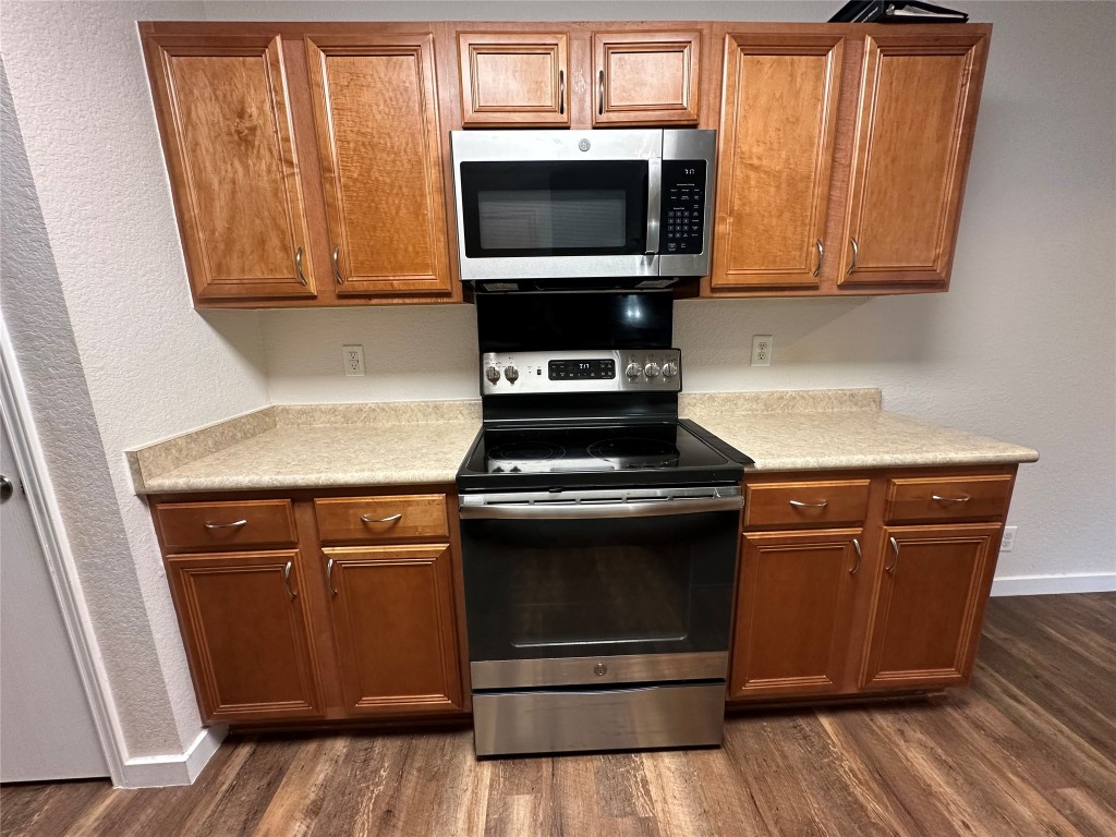 113 Lex Word Kyle, TX 78640 - Photo 11 of 40 a kitchen with granite countertop cabinets and steel stainless steel appliances