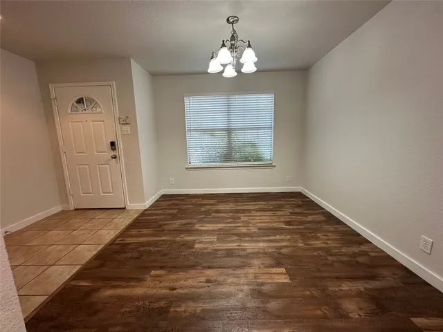 a kitchen with a refrigerator and a sink