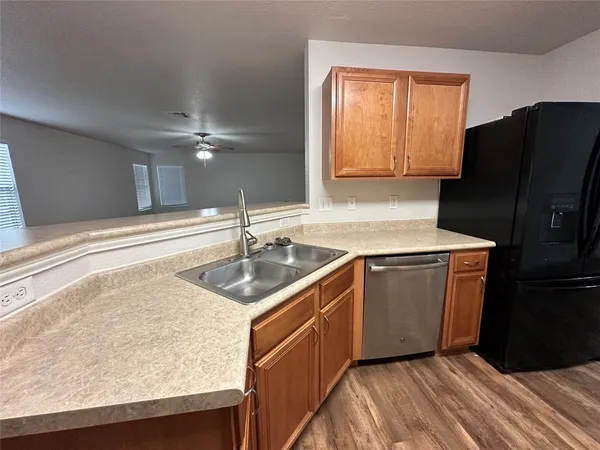 a kitchen with granite countertop cabinets and steel stainless steel appliances