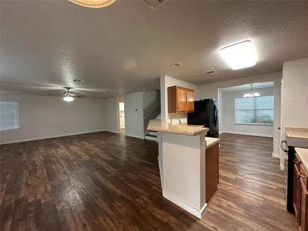 a kitchen with a sink stove and refrigerator