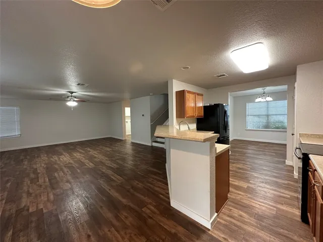 a kitchen with a sink stove and refrigerator