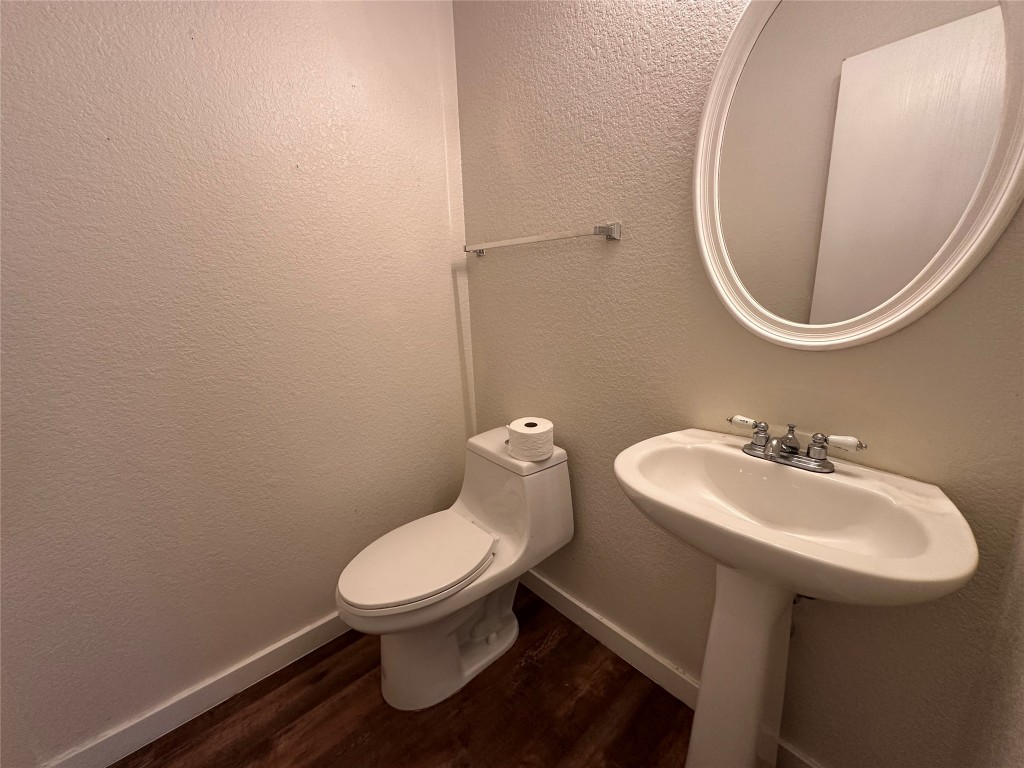 113 Lex Word Kyle, TX 78640 - Photo 16 of 40 a bathroom with a sink a toilet and a mirror