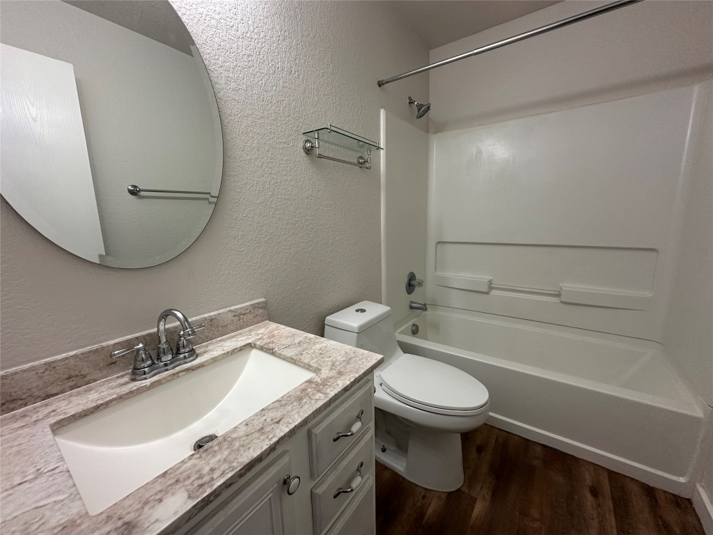 113 Lex Word Kyle, TX 78640 - Photo 23 of 40 a bathroom with a granite countertop toilet sink and mirror