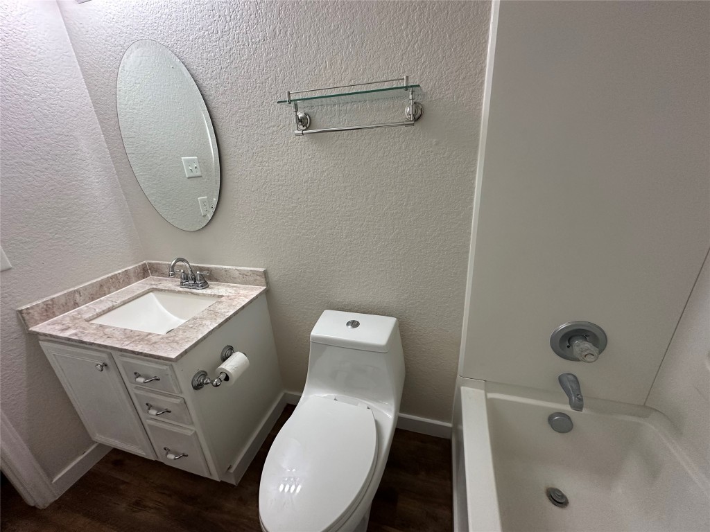 113 Lex Word Kyle, TX 78640 - Photo 24 of 40 a bathroom with a sink toilet and a mirror