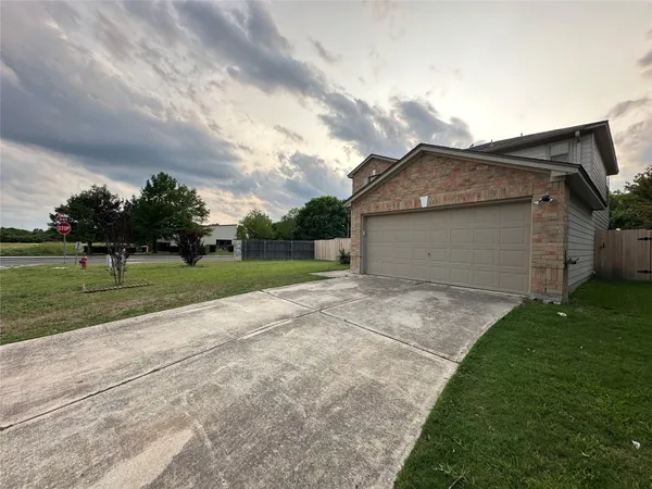 a view of backyard of house with outdoor seating and entertaining space