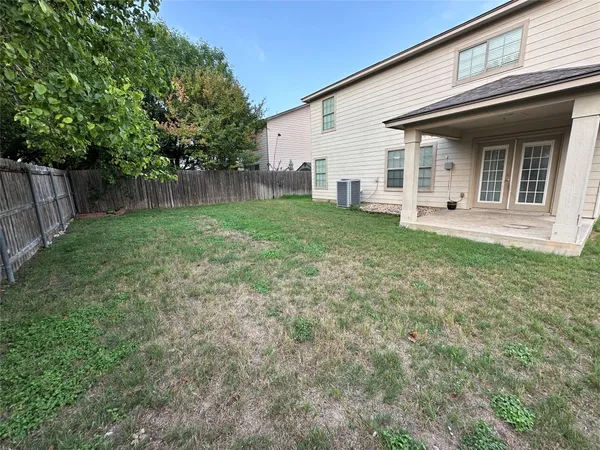 a view of backyard with green space