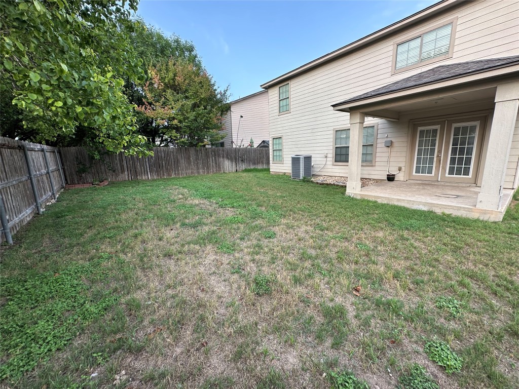 113 Lex Word Kyle, TX 78640 - Photo 38 of 40 a view of a backyard with plants and large trees