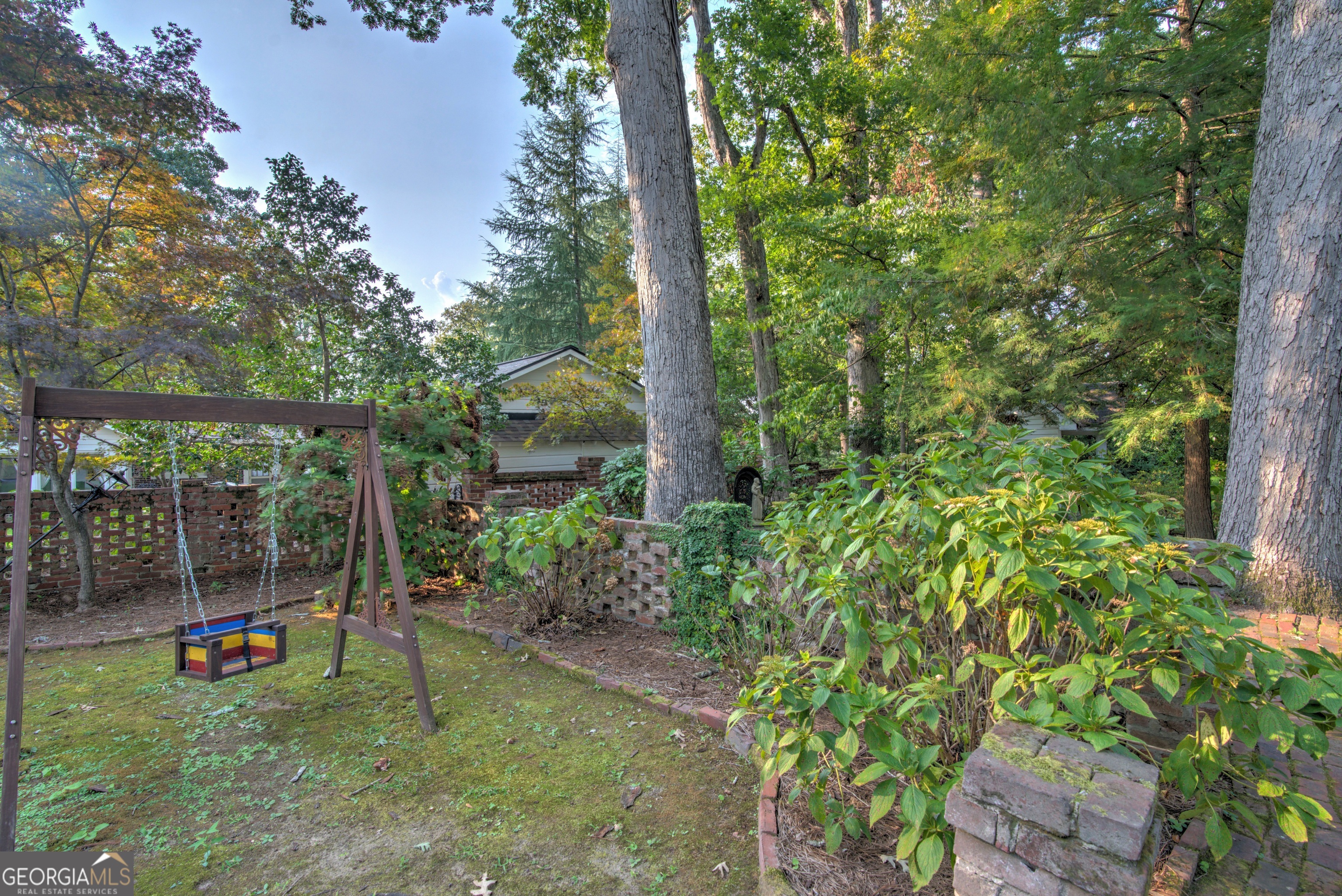 209 Sherwood Road Southwest Rome, GA 30165 - Photo 67 of 71 a backyard of a house with plants and outdoor seating