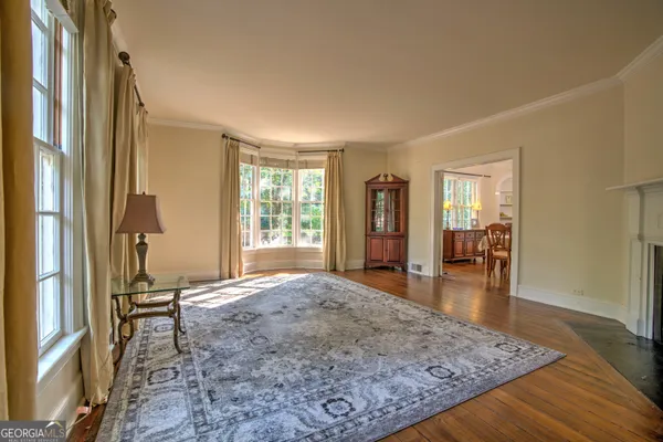 a view of a dining room with furniture window and wooden floor