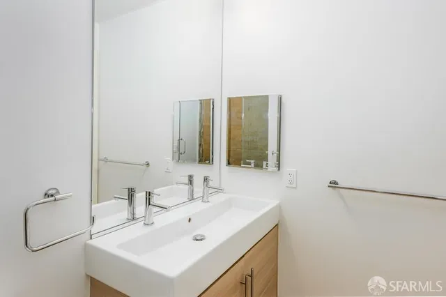a bathroom with a sink and mirror