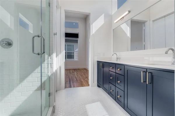 a bathroom with a sink and mirror