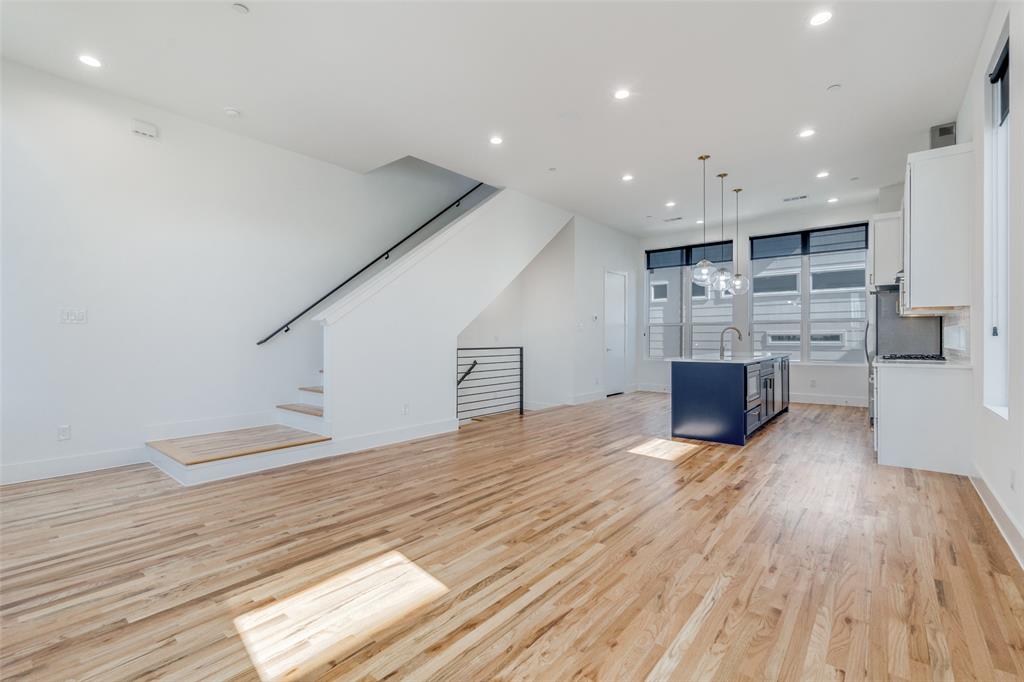 4718 Bryan Street, Unit 301 Dallas, TX 75204 - Photo 2 of 12 a view of kitchen with furniture and wooden floor
