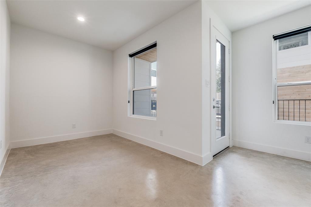 4718 Bryan Street, Unit 301 Dallas, TX 75204 - Photo 7 of 12 an empty room with windows and closet
