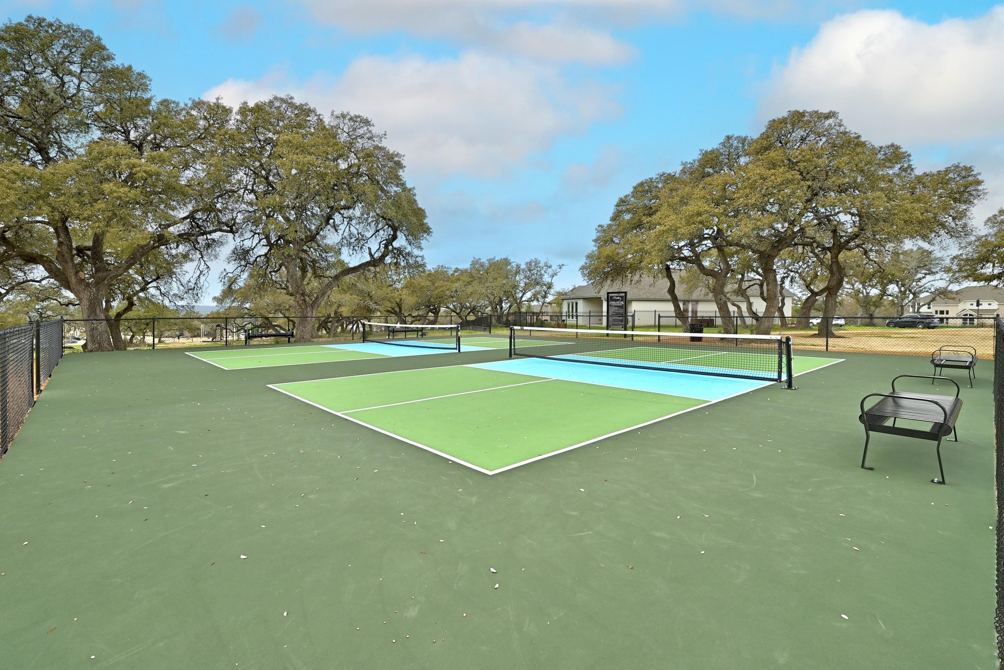 208 West Branch Road Kyle, TX 78640 - Photo 27 of 27 Pickleball and tennis courts promote friendly competition amongs neighbors.